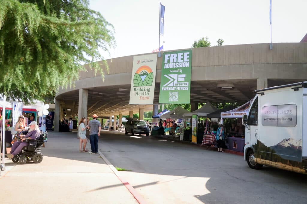 Free Admission provided by EveryDay Fitness banner hanging from the upper balcony of the Redding Civic Auditorium at the Redding Health Expo.