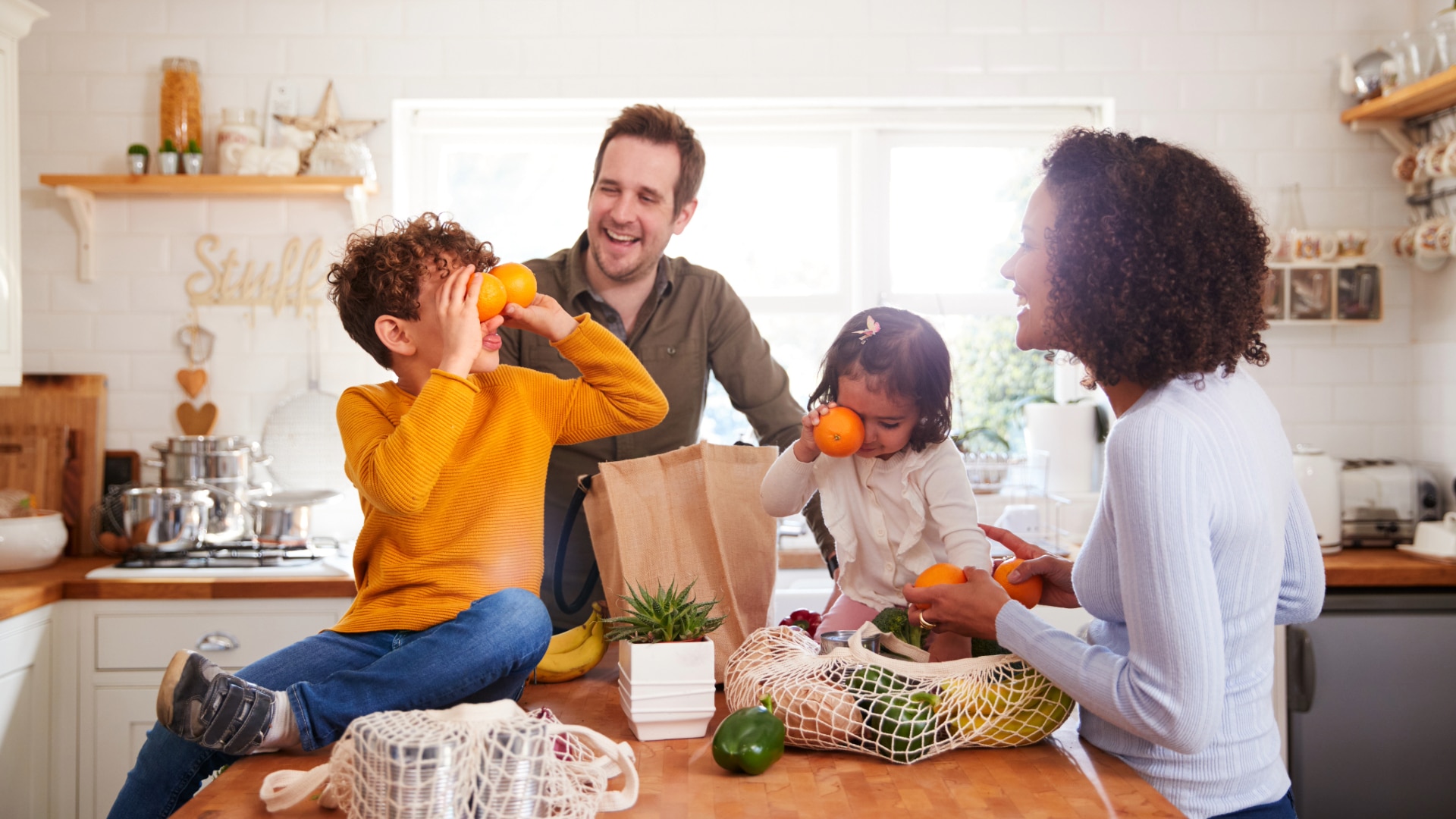 family cooking a healthy meal together